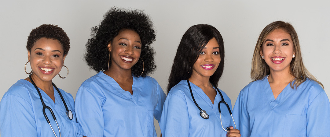 yolo-1080x450-68 Multi-racial group of nurses wearing blue scrubs